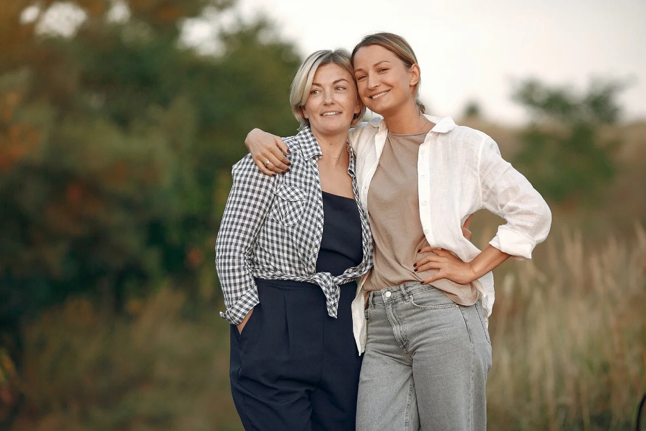 2 Happy women of different ages hugging in nature