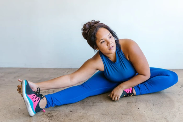 a woman stretching on the floor