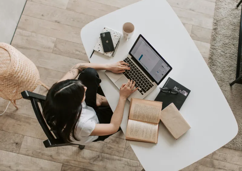 a woman using her laptop on a birds eye view