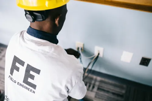 an electrician fixing the cable